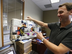 Former Ontario Progessive Conservative leader Tim Hudak packs up his old travelling Tourism suitcase that is totally stickered on Wednesday September 14, 2016. Jack Boland/Toronto Sun/Postmedia Network