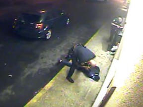 Screen grab of officer kicking a suspect who is handcuffed. (Youtube)