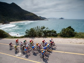 In this photo released by the IOC, cyclists compete in the men's road cycling race C4-5 during the Paralympic Games in Rio de Janeiro, Brazil, on Saturday, Sept. 17, 2016. (Simon Bruty/OIS, IOC via AP)