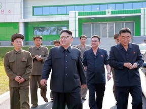 This undated picture released from North Korea's official Korean Central News Agency (KCNA) on September 15, 2016 shows North Korean leader Kim Jong-Un (C) inspecting the newly-built Medical Oxygen Factory in suburban Pyongyang. (AFP/KCNA/AFP/Getty Images)