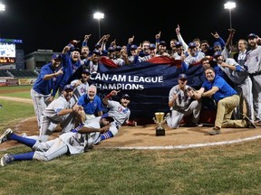 The Ottawa Champions celebrate their Can-Am League championship after winning three straight to take the series in five games. (Drew Wohl)