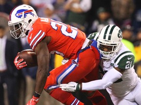 Bills running back LeSean McCoy (left) is tackled by Jets free safety Marcus Gilchrist (right) during second half NFL action in Orchard Park, N.Y., on Thursday, Sept. 15, 2016. (Bill Wippert/AP Photo)