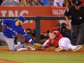 Angels' Mike Trout (right) steals third as Blue Jays third baseman Josh Donaldson puts a late tag on him during sixth inning MLB action in Anaheim, Calif., on Saturday, Sept. 17, 2016. (Mark J. Terrill/AP Photo)