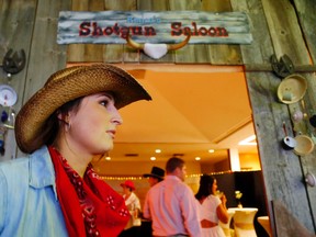 Volunteer bartender Chelsea Cowie waits for customers outside the saloon facade at the Wild Wild West Gala for the Belleville General Hospital Foundation. The event in the Sears Atrium raised $279,000 for regional cancer care.