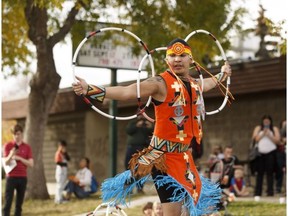 Hoop dancer Lakota Tootoosis dances during the Spruce Avenue Community League's Harvest Festival on Community League Day in Edmonton, Alberta on Saturday, September 17, 2016. Ian Kucerak / Postmedia