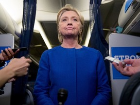 Democratic presidential candidate Hillary Clinton pauses while she gives remarks on the explosion in Manhattan's Chelsea neighborhood onboard her campaign plane at Westchester County Airport, in White Plains, N.Y., on  Sept. 17, 2016.