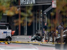 Debris and a mangled toolbox sit on the sidewalk at the scene of an explosion on West 23rd street in the Chelsea neighborhood of New York, Sunday, Sept. 18, 2016, after an incident that injured passers-by Saturday evening. (AP Photo/Craig Ruttle)