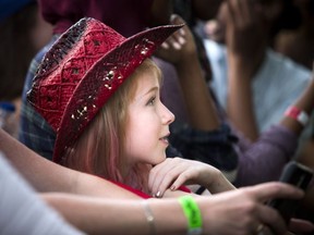 Ten-year-old Delaney Duguette was very excited for Dean Brody to hit the City Stage on the great lawn at Lansdowne Park on Sunday, Sept. 18, 2016 during the last day of CityFolk. ASHLEY FRASER / POSTMEDIA