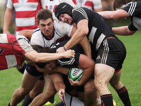 OCAA men's rugby between Loyalist (white jerseys) and Kingston St. Lawrence, Saturday at MAS Park. (Isaac Paul for The Intelligencer)