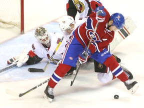 Artturi Lehkonen of the Canadians tries to shovel a loose puck between his legs as goaltender Bryan Pitton of the Senators is down during a scramble in front of the net at the 2016 Rookie Tournament at Budweiser Gardens in London, Ont. on Sunday, Sept. 18, 2016. (Mike Hensen/Postmedia Network)