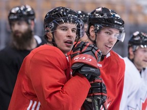Team Canada's Sidney Crosby (front left) and Logan Couture watch a drill during a training session for the World Cup of Hockey in Toronto on Sept. 16, 2016. (Chris Young/The Canadian Press)