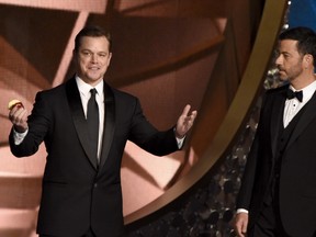 Actor Matt Damon (L) and host Jimmy Kimmel speak onstage during the 68th Emmy Awards show on September 18, 2016 at the Microsoft Theatre in downtown Los Angeles. /(AFP PHOTO / Valerie MACONVALERIE MACON/AFP/Getty Images)