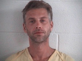 This photo provided by Ashland County Sheriff Office shows Shawn M. Grate. Grate, was arrested Tuesday, Sept. 13, 2016, in Ashland, Ohio in connection to the investigation of a rescued abductee and the discovery of the remains of two people in the home where he was arrested. (Ashland County Sheriff Office /The Times Gazette via AP)