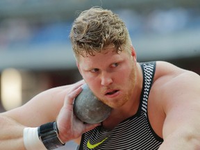 Ryan Crouser of the United States competes in the men's shot put event at the IAAF Diamond League athletics meeting at Stade de France stadium in Saint Denis, north of Paris, France, on Aug. 27, 2016. (AP Photo/Michel Euler)