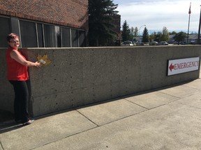Drayton Valley Health Foundation (DVHF) Fund Development Officer Colleen Sekura shows where the maple leaves will be placed at the Drayton Valley Hospital and Care Centre. The Maple Leaves Forever campaign was launched to help raise money for the CT4DV campaign and other future projects of DVHF.