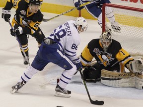 Toronto Maple Leafs' Nikita Korostelev (68) carries the puck and scores on Pittsburgh Penguins goalie Casey DeSmith at the 2016 NHL rookie tournament in London, Ont., on Sunday, Sept. 18, 2016. (THE CANADIAN PRESS/Dave Chidley)