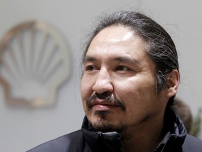 Chief Allan Adam of Athabasca Chipewyan First Nation stands inside the Shell Centre in downtown Calgary on Wednesday, November 30, 2011. Athabasca Chipewyan First Nation served Shell Canada with intent to sue over what it claims are treaty violations with a pair of oilsands projects. LYLE ASPINALL/CALGARY SUN