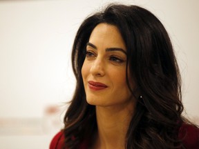 In this Jan. 25, 2016, file photo, British lawyer Amal Clooney attends a press conference with former Maldives president Mohamed Nasheed in London. Clooney is pushing for the United Nations to investigate and prosecute Islamic State commanders for genocide. Clooney wants IS leaders tried over the killings. The British lawyer appeared on NBC’s “Today” show in an interview broadcast Monday, Sept. 19, 2016, alongside 23-year-old Nadia Murad, a Yazidi woman who escaped after being captured by IS in 2014. (AP Photo/Alastair Grant, File)