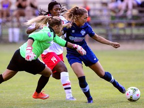 FC London striker Jade Kovacevic, right, evades Vaughan Azzuri goaltender Stephanie Bukovec, left, and defender Courtney Douglas on her way to scoring the first goal of the game during an League 1 Ontario  semi-final game at Cove Road field. (MORRIS LAMONT, The London Free Press)