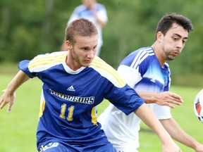 Laurentian Voyageurs Zef Kraja battles for the ball during OUA action against the UOIT Ridgebacks in Sudbury, Ont. on Sunday September 18, 2016. Gino Donato/Sudbury Star/Postmedia Network