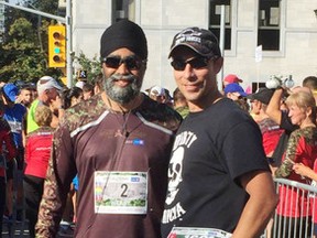 Afghanistan veterans retired master corporal Collin Fitzgerald, right, and Minister of National Defence Harjit Sajjan pose for a photo at the Canada Army Run in Ottawa on Sunday. Fitzgerald carried bib number 1601 in memory of Maj. Michelle Mendes. (Photo courtesy Kerri Tadeu)