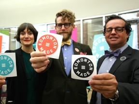 Carmen Douville, project facilitator for Edmonton Made, Duchess Bake Shop co-owner Garner Beggs and Coun. Michael Oshry, show the badges that will identify Edmonton-made businesses. BILL MAH / Postmedia