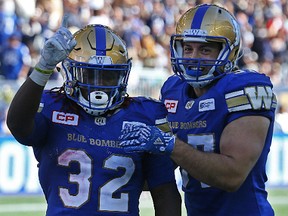 Winnipeg Blue Bombers RB Timothy Flanders (left) celebrates his touchdown run against the Toronto Argonauts on Saturday. (Kevin King/Winnipeg Sun photo)