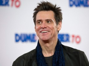 This file photo taken on November 20, 2014 shows US actor Jim Carrey poses for photographers at a photocall for the film "Dumb and Dumber To" in London. Veteran comic actor Jim Carrey was sued September 91, 2016 for allegedly procuring drugs under a bogus name for his ex-girlfriend who died of an overdose last year and then trying to hide his involvement. According to the suit filed in Los Angeles Superior Court by Mark Burton, the estranged husband of Carrey's former girlfriend Cathriona White, the actor "used his immense wealth and celebrity status" to obtain opioids for White. JUSTIN TALLIS/AFP/Getty Images