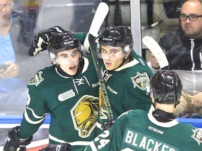 Liam Foudy, the Knights #1 draft pick celebrates with Sam Miletic and Ian Blacker after Foudy scored his second of the game on a nice pass from Miletic during the second period of their game against the Erie Otters at Budweiser Gardens in London. (MIKE HENSEN, The London Free Press)