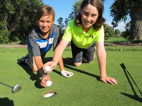Patrick Kennedy/The Whig-Standard/Postmedia Network
Nolan Fox, left, and Kaiden Trainor, teammates on the Loyalist Jets peewee rep hockey team, clicked for back-to-back holes-in-one on Monday, Sept. 19, on the 139-yard, part-3 fifth hole at Amherstview Golf Club.