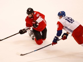 Steven Stamkos of Team Canada makes a pass from his knees next to Ondrej Palat of Team Czech Republic during the World Cup of Hockey. (Photo by Gregory Shamus/Getty Images)