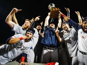 Winnipeg Goldeyes players and manager Rick Forney celebrate following their 11-4 victory over the Wichita Winghuts in Game 5 of the American Association final on Monday, September 19, 2016, in Wichita, Kans.
Manny De Los Santos/Wichita Eagle