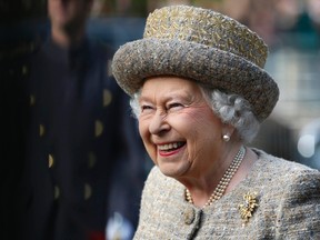 Queen Elizabeth II smiles as she arrives before the Opening of the Flanders' Fields Memorial Garden at Wellington Barracks on November 6, 2014 in London, England. (Photo by Stefan Wermuth - WPA Pool /Getty Images)