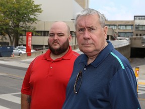 A poll of Kingston residents shows overwhelming support for local hospitals, say Canadian Union of Public Employees Local 1974 president Mike Rodrigues, left, and Michael Hurley, president of the Ontario Council of Hospital Unions on Tuesday. (Elliot Ferguson/The Whig-Standard)