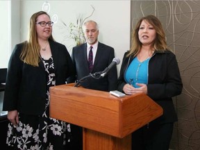 Evelinne Teichgraber, owner of Caliber Insurance Brokers, speaks on Sept. 20, 2016 to reporters about how taking entrepreneur training helped her start a business. Labour Minister Christina Gray and Paul Anderson, of Anderson Career Training Institute look on BILL MAH / POSTMEDIA