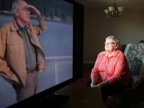 Mary McKinlay, 72, and her husband Jim (on screen) had just moved back to Ottawa a few months ago from their trailer in British Columbia when Jim, 68, was diagnosed with lung cancer. Jim died on Sept. 15th at Elizabeth Bruyere Hospital. JULIE OLIVER / POSTMEDIA