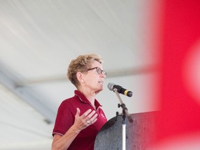 Premier Kathleen Wynne speaks at the opening ceremonies of International Plowing Match in Harriston, Ont. on Tuesday, September 20, 2016. THE CANADIAN PRESS/Hannah Yoon