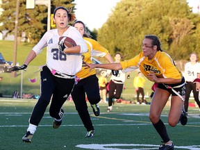Emily Tilbury of the Bishop Alexander Carter Gators tries to tag out Allison Byrnes of the Marymount Academy Regals during division a high school flag football action from James Jerome Field in Sudbury, Ont. on Tuesday September 20, 2016. Gino Donato/Sudbury Star/Postmedia Network