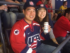 Albert Lin and Julia Chu, from Los Angeles, at the ACC Tuesday, Sept. 20, 2016 for the Canada-U.S.A. World Cup of Hockey match. (Joe Warmington/Toronto Sun)