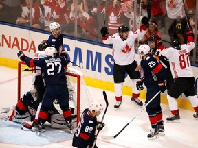 John Tavares of Team Canada celebrates his second-period goal by Patrice Bergeron with Sidney Crosby while playing Team USA during the World Cup of Hockey at the Air Canada Center on September 20, 2016 in Toronto, Canada. (Gregory Shamus/Getty Images)