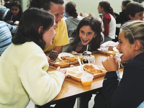 Students talk in the school cafeteria during lunch October 15, 2002 at North Hampton School in North Hampton, New Hampshire (Debbi Morello/Getty Images)