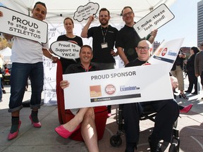 The Postmedia team poses for a photo during YWCA Edmonton's Walk A Mile In Her Shoes in Edmonton, Alberta on Wednesday, September 21, 2016. Over $200,000 was raised for YWCA violence prevention and recovery programs. Ian Kucerak / Postmedia