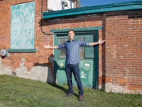 Jon Jeremonis, representative and architect from RAW Designs, stands outside his future place of work in Kingston on Wednesday, after the Toronto-based firm finalized the purchase of the old Bailey Broom Factory with the goal of retrofitting it to include the firm's branch office, cafe and a community hub. (Julia McKay/The Whig-Standard)