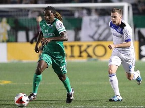 FC Edmonton midfielder Nik Ledgerwood, right, chases down New York Cosmos midfielder Lucky Mkosana in a North American Soccer League game Saturday Sept. 17, 2016 in Hempstead, NY. The game finished in a scoreless tie.