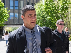 York Regional Police Det.-Const. Remo Romano leaves 361 University Ave. courthouse after his first trial ended in a hung jury May 18, 2016. (Craig Robertson/Toronto Sun)