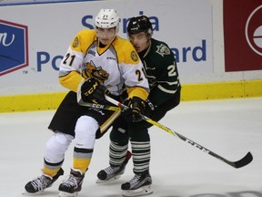 Sarnia Sting forward Adam Ruzicka and London Knights centre Robert Thomas battle for body position near a loose puck during the Ontario Hockey League game at Progressive Auto Sales Arena on Wednesday, Sept. 21, 2016 in Sarnia, Ont. Ruzicka had three assists in his Sting debut. Terry Bridge/Sarnia Observer/Postmedia Network