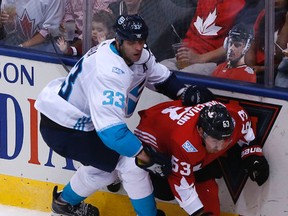 Team Europe’s Zdeno Chara grabs Team Canada’s Brad Marchand from behind at the Air Canada Centre last night. (Michael Peake/Toronto Sun)