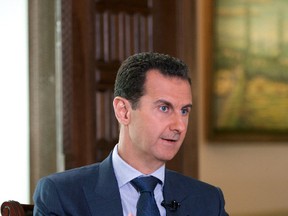 In this Wednesday, Sept. 21, 2016 photo released by the Syrian Presidency, Syrian President Bashar Assad speaks to The Associated Press, at the presidential palace in Damascus, Syria. Assad said U.S. airstrikes on Syrian troops in the country’s east were “definitely intentional,” lasting for an hour, and blamed the U.S. for the collapse of a cease-fire deal brokered with Russia. In the interview with the AP, Assad said the war, now in its sixth year, is likely to “drag on” because of what he said was continued external support for his opponents. (Syrian Presidency via AP)