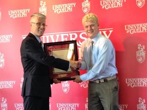 Sean Mitchell receiving the Chancellor’s Scholarship from Dr. Malcolm Campbell, the Vice President of Research for the University of Guelph at an awards luncheon held Friday, September 6, 2016. (Contributed photo)