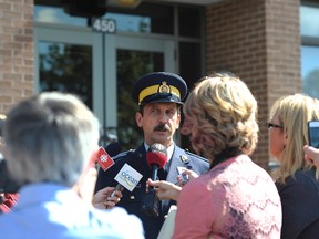 RCMP Staff Sergeant Kevin A. Baillie speaks to reporters outside the provincial RCMP headquarters in Charlottetown, P.E.I., on Wednesday, September 21, 2016. RCMP say someone faxed a bomb threat against schools on Prince Edward Island. (THE CANADIAN PRESS/Nathan Rochford)